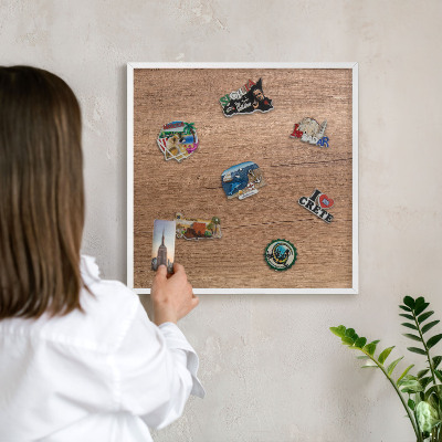 Magnetic board for travel magnets in a white frame Wood texture