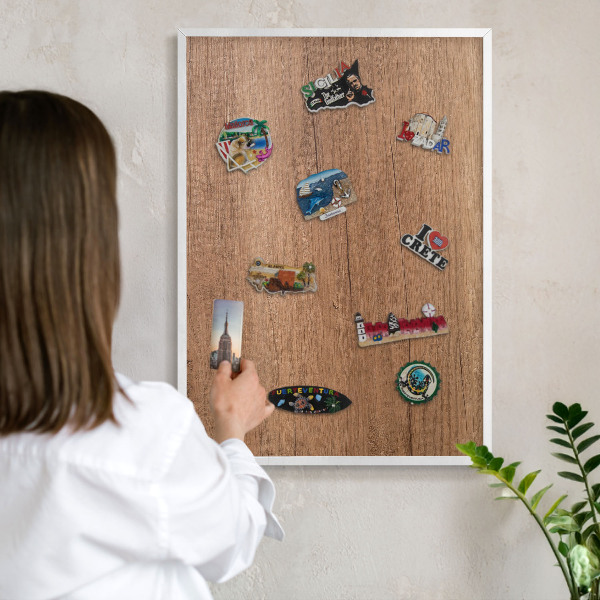 Magnetic board for travel magnets in a white frame Wood texture