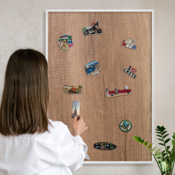 Magnetic board for travel magnets in a white frame Wood texture