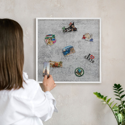 Magnetic board for travel magnets in a white frame Gray surface