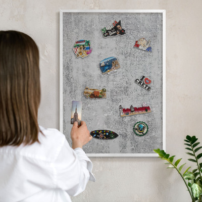 Magnetic board for travel magnets in a white frame Gray surface