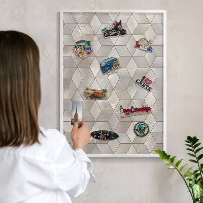 Magnetic board for travel magnets in a white frame Cubic background