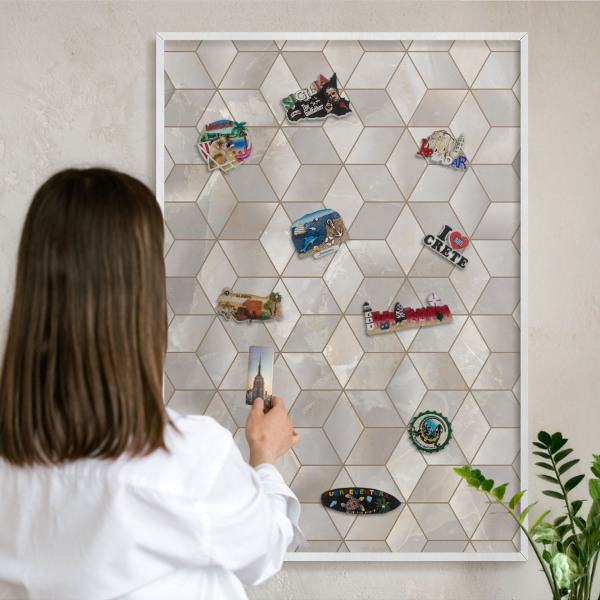 Magnetic board for travel magnets in a white frame Cubic background
