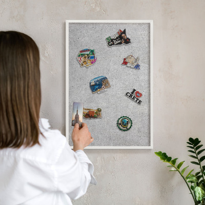 Decorative magnet board with a white frame Gray texture