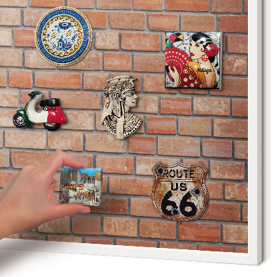Magnetic board for travel magnets in a white frame Brick wall