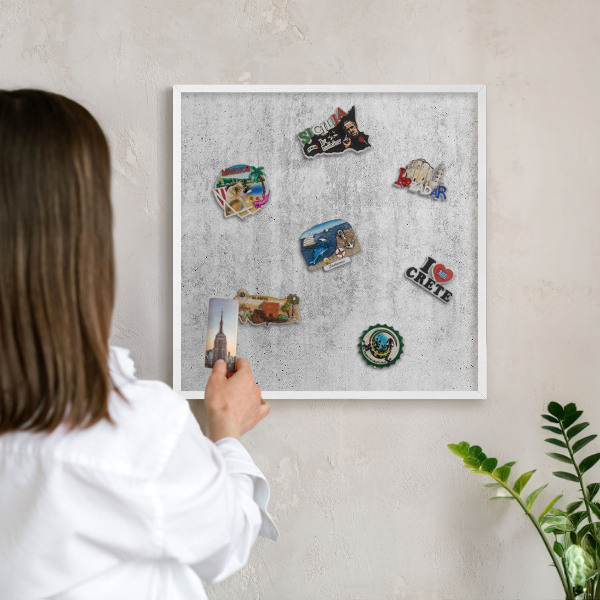 Magnetic board for travel magnets in a white frame Gray texture