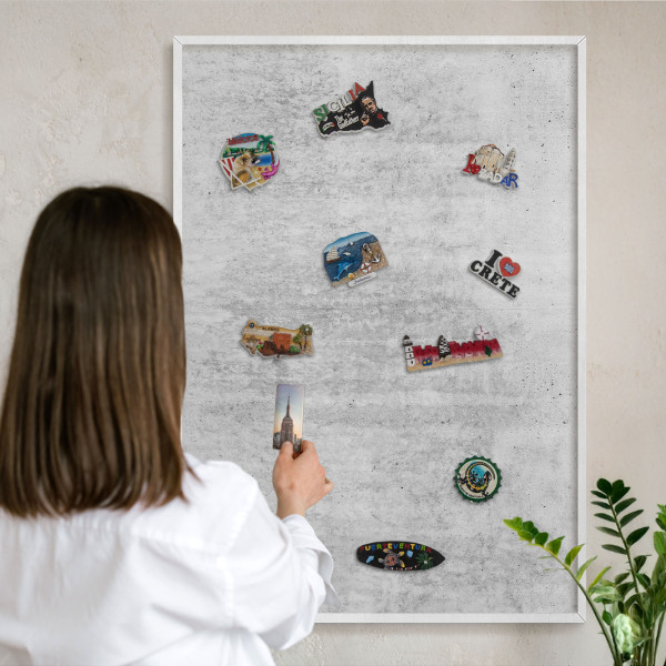 Magnetic board for travel magnets in a white frame Gray texture
