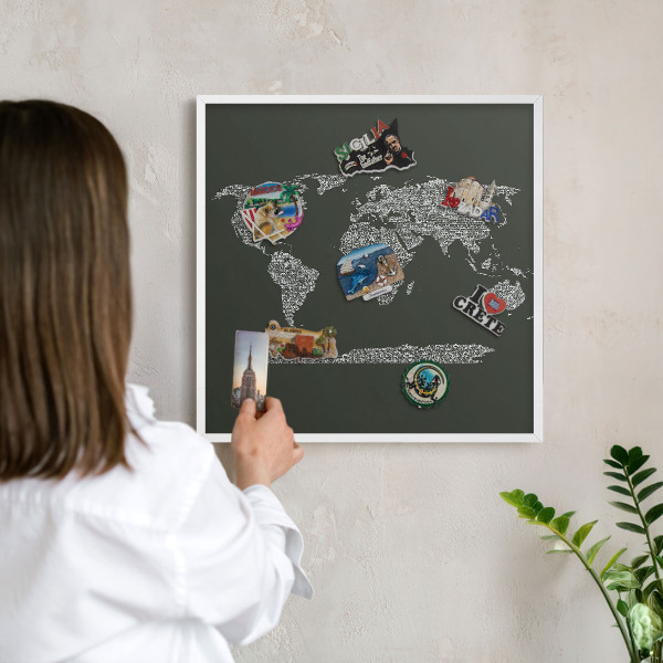 Magnetic board for travel magnets in a white frame Text map
