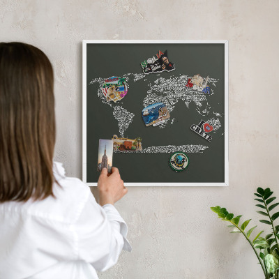 Magnetic board for travel magnets in a white frame Text map