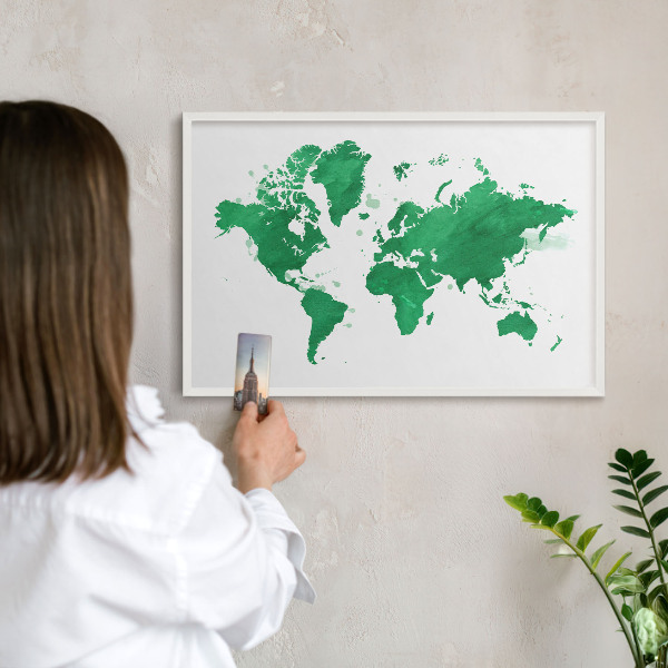 Magnetic board for travel magnets in a white frame Green map