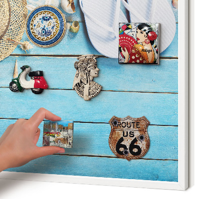 Magnetic board for travel magnets in a white frame Holiday atmosphere