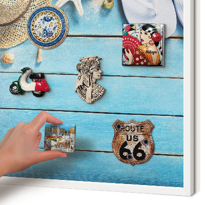 Magnetic board for travel magnets in a white frame Holiday atmosphere