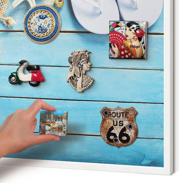 Magnetic board for travel magnets in a white frame Holiday atmosphere