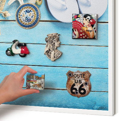 Magnetic board for travel magnets in a white frame Holiday atmosphere