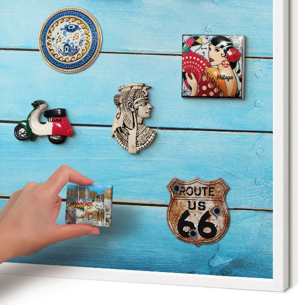 Magnetic board for travel magnets in a white frame Holiday atmosphere
