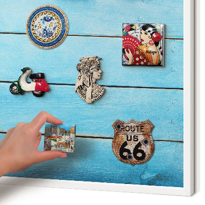 Magnetic board for travel magnets in a white frame Holiday atmosphere