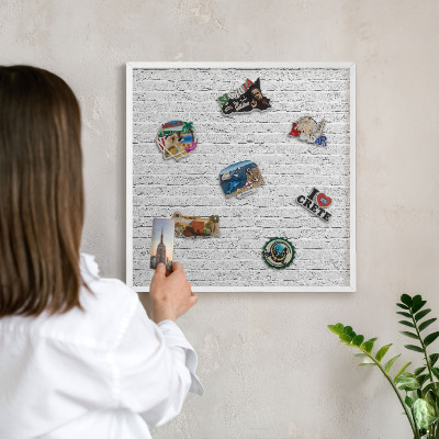 Decorative magnet board with a white frame Brick wall
