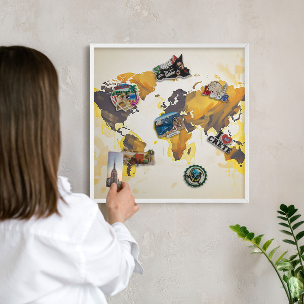 Magnetic board for travel magnets in a white frame World map