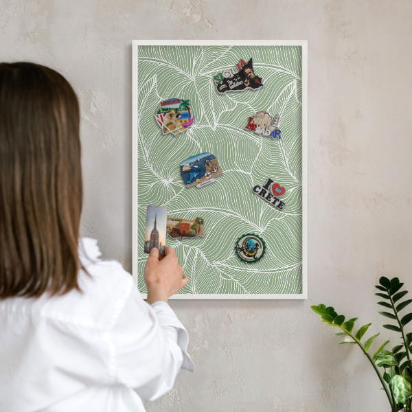 Magnetic board for travel magnets in a white frame Tropical leaves