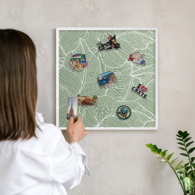 Magnetic board for travel magnets in a white frame Tropical leaves