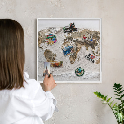 Magnetic board for travel magnets in a white frame Relief map