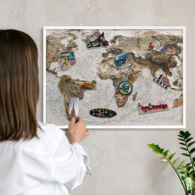 Magnetic board for travel magnets in a white frame Relief map