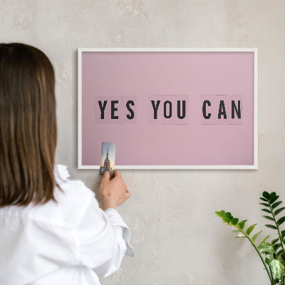 Magnetic board for travel magnets in a white frame Motivation every day