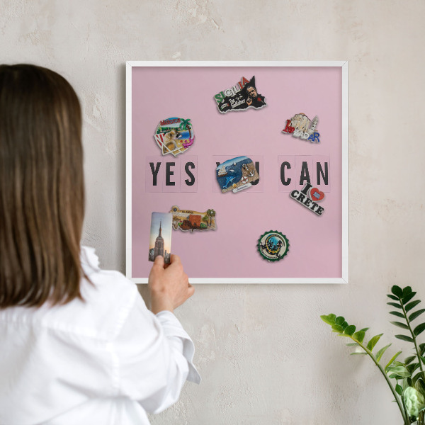 Magnetic board for travel magnets in a white frame Motivation every day