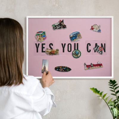 Magnetic board for travel magnets in a white frame Motivation every day