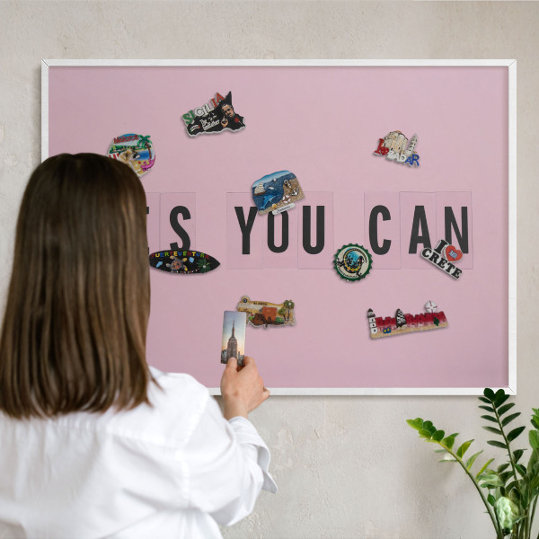 Magnetic board for travel magnets in a white frame Motivation every day