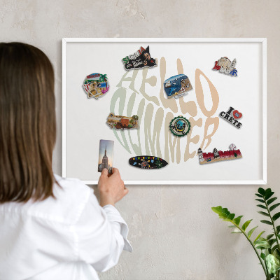 Magnetic board for travel magnets in a white frame Hello summer