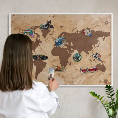 Magnetic board for travel magnets in a white frame World map