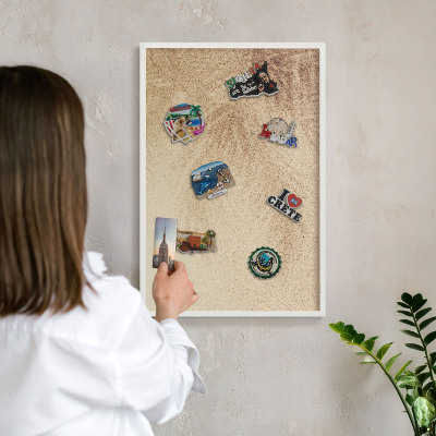 Magnetic board for travel magnets in a white frame Sand leaves