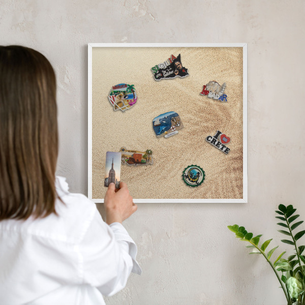 Magnetic board for travel magnets in a white frame Sand leaves