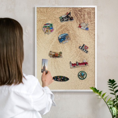 Magnetic board for travel magnets in a white frame Sand leaves