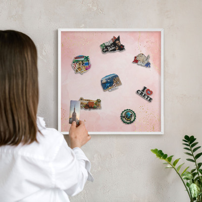 Magnetic board for travel magnets in a white frame Subtle elegance