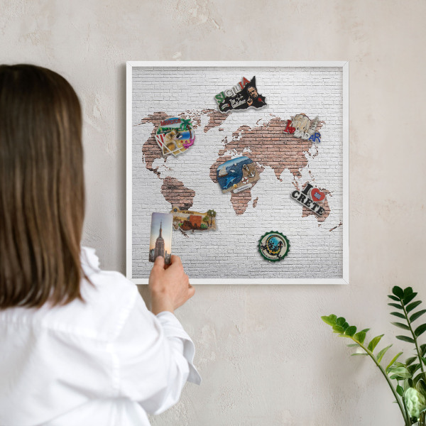 Decorative magnet board with a white frame Brick map