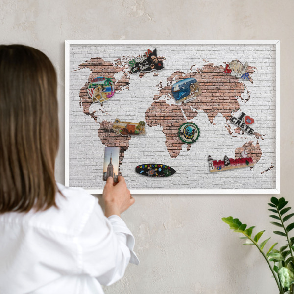 Decorative magnet board with a white frame Brick map