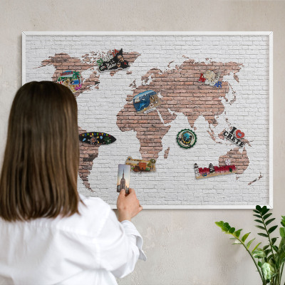 Decorative magnet board with a white frame Brick map