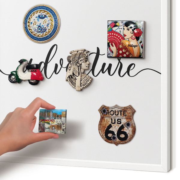 Decorative magnet board with a white frame Adventure written