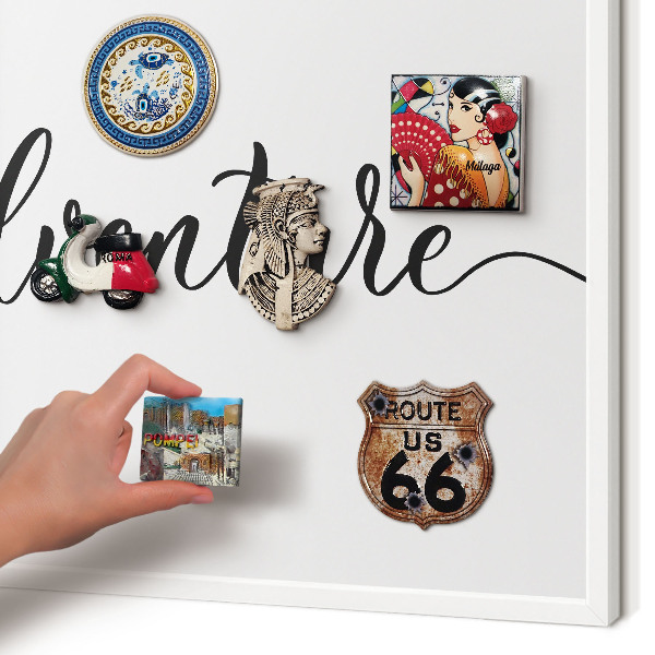 Decorative magnet board with a white frame Adventure written