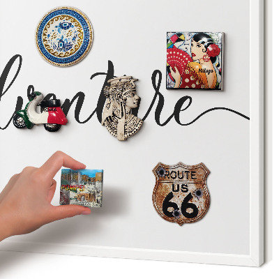 Decorative magnet board with a white frame Adventure written