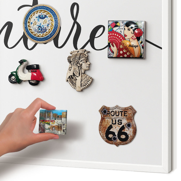 Decorative magnet board with a white frame Adventure written