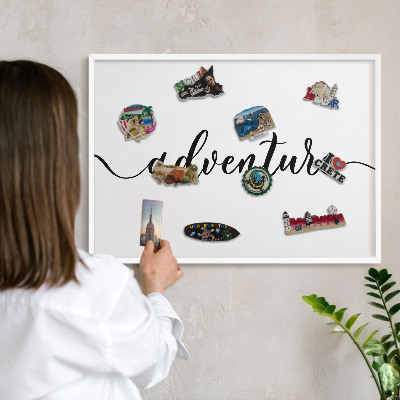 Decorative magnet board with a white frame Adventure written