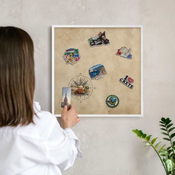 Magnetic board for travel magnets in a white frame Wind rose