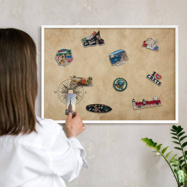 Magnetic board for travel magnets in a white frame Wind rose