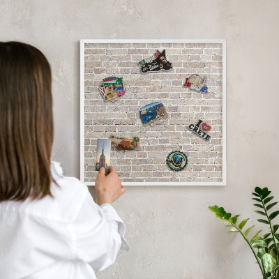 Magnetic board for travel magnets in a white frame Brick pattern