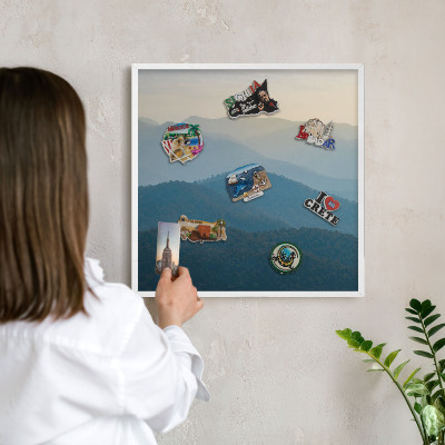 Magnetic board for travel magnets in a white frame Mountain views