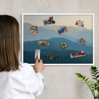 Magnetic board for travel magnets in a white frame Mountain views