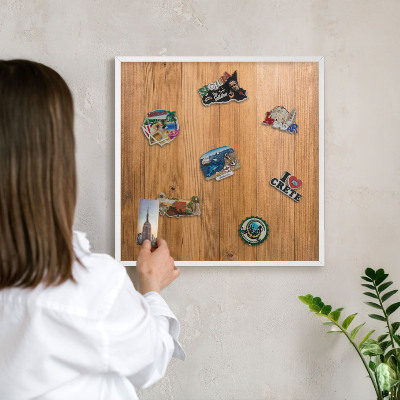 Magnetic board for travel magnets in a white frame Wooden texture
